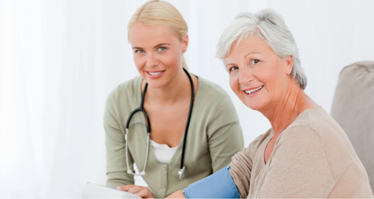 Lovely doctor taking the blood pressure of her patient Lovely doctor taking the blood pressure of her patient